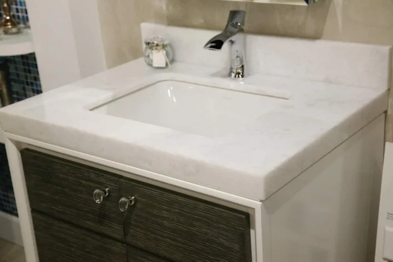 Designer bathroom vanity with a marble countertop at the Hills Showcase showroom in Naples, FL.