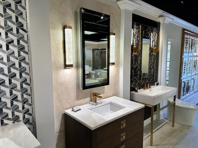 Couple of elegant hand-built bathroom vanity displays at the Hills Showcase showroom in Naples, FL.